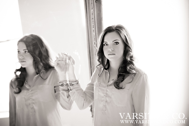 girl against a mirror senior picture