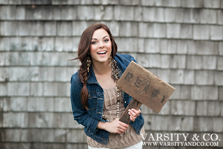 girl holding a ready sign senior picture