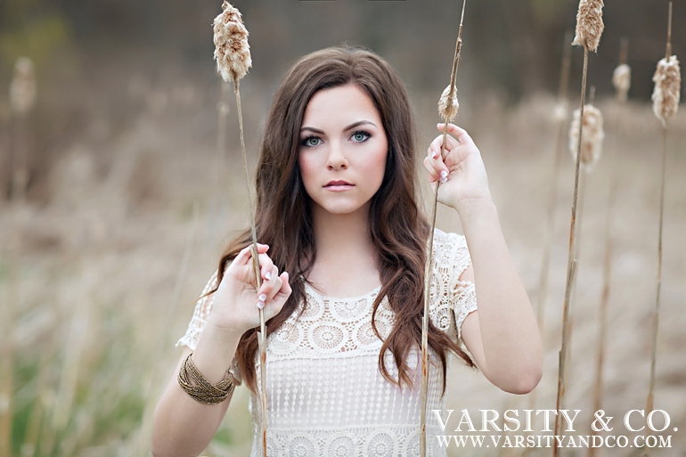 girl holding cattails senior picture