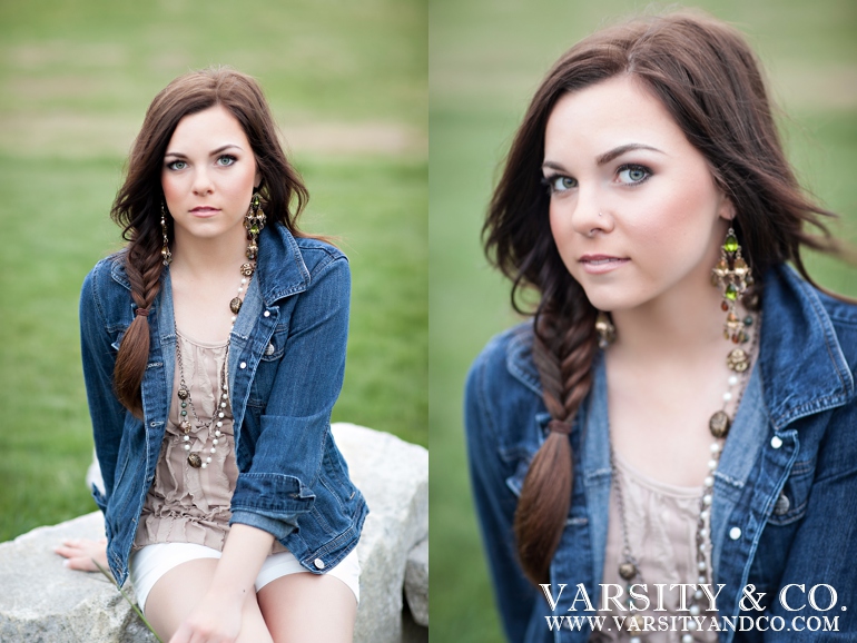 girl sitting on a rock senior picture