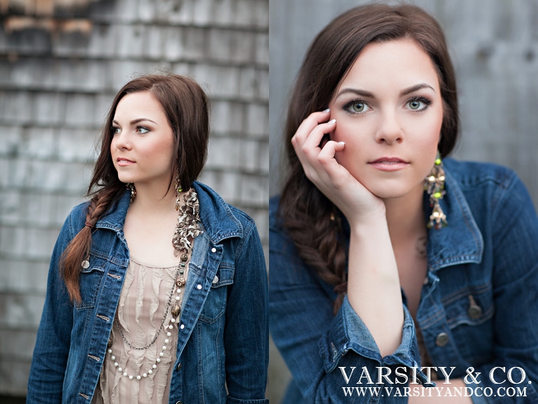 girl against a shingled barn senior picture