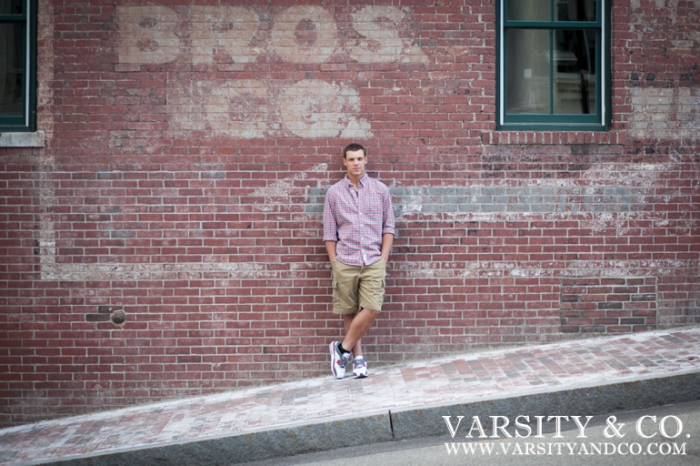 Guys senior pictures against a brick wall