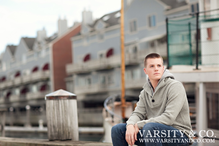 guy sitting on the dock in Maine senior picture