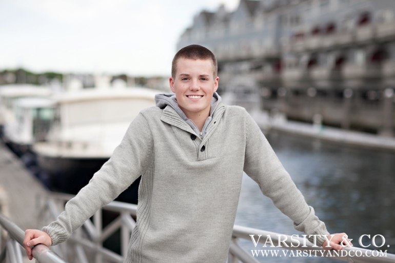 guy standing by the dock in Maine senior picture