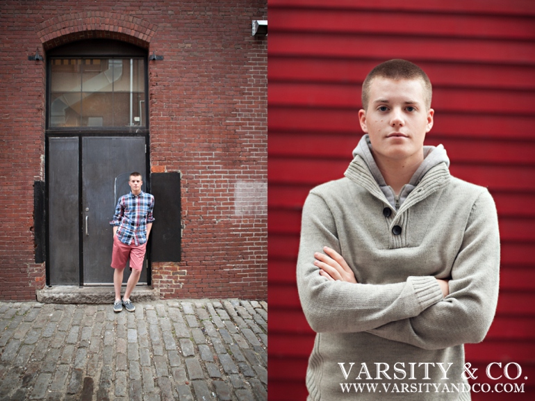 guy against a brick building senior picture