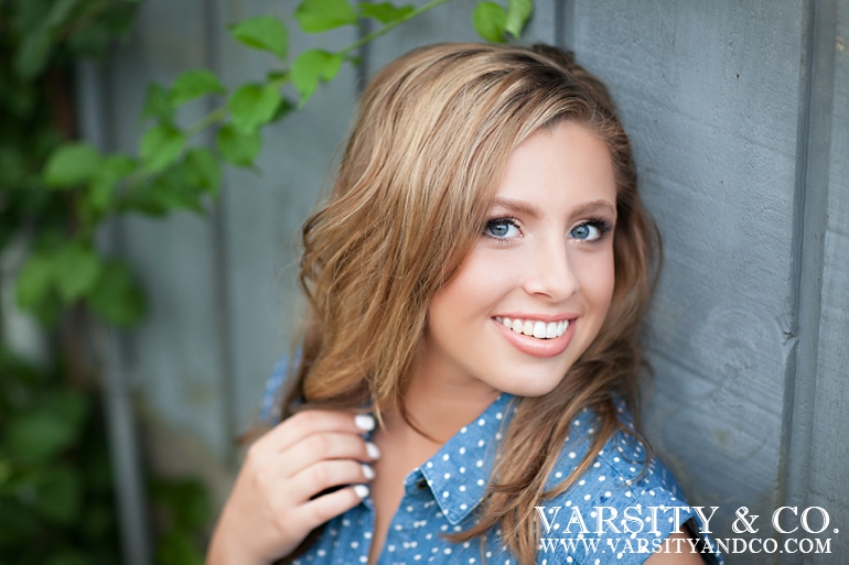 girl in blue polka dot dress senior picture