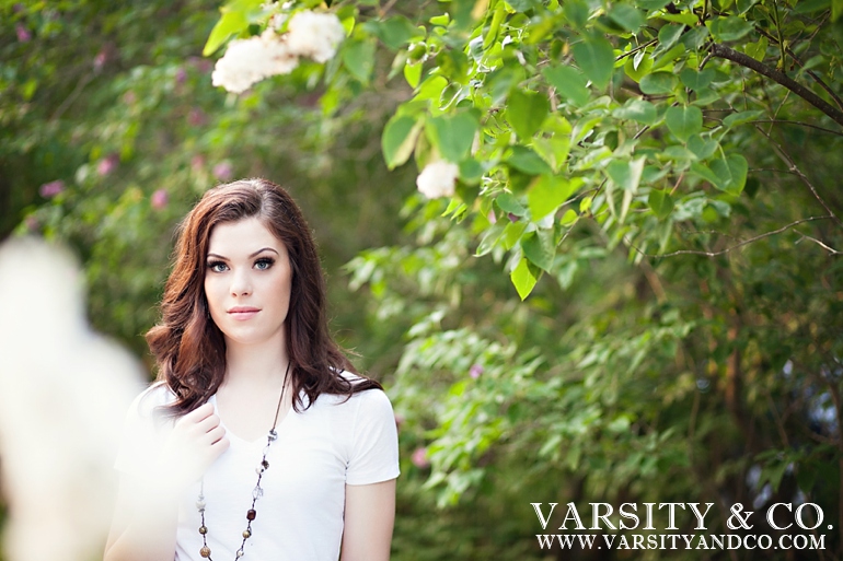 girl standing in the bushes senior picture