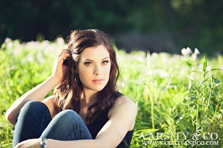 girl in the grass senior picture