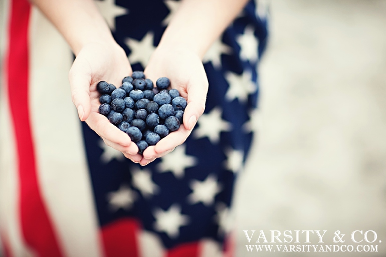 handful of blueberries and an american flag