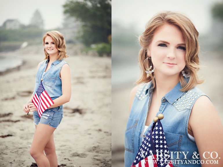 girl holding and american flag on the beach senior picture